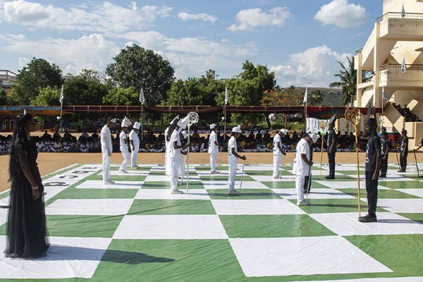 School children in Madurai dress up as chess pieces for a demo